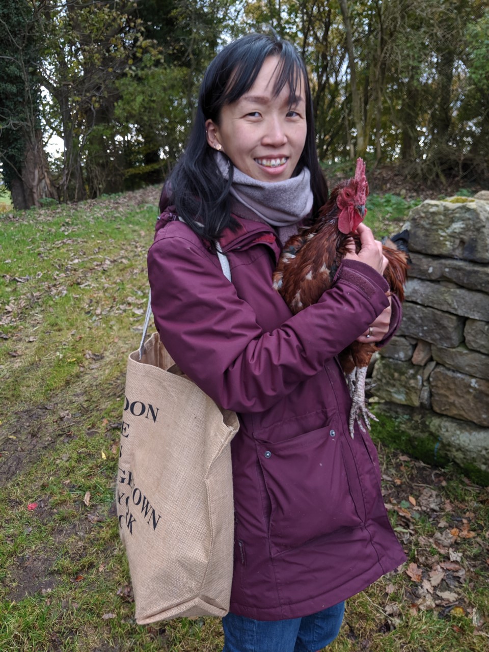 Michelle Cuninghame, a Veganuary participant, holding a chicken. She found that her cholesterol levels decreased after going vegan.