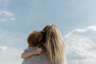 Unidentified woman holding her young son