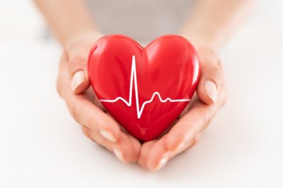 Person holding red heart