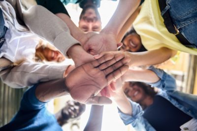 People putting hands together
