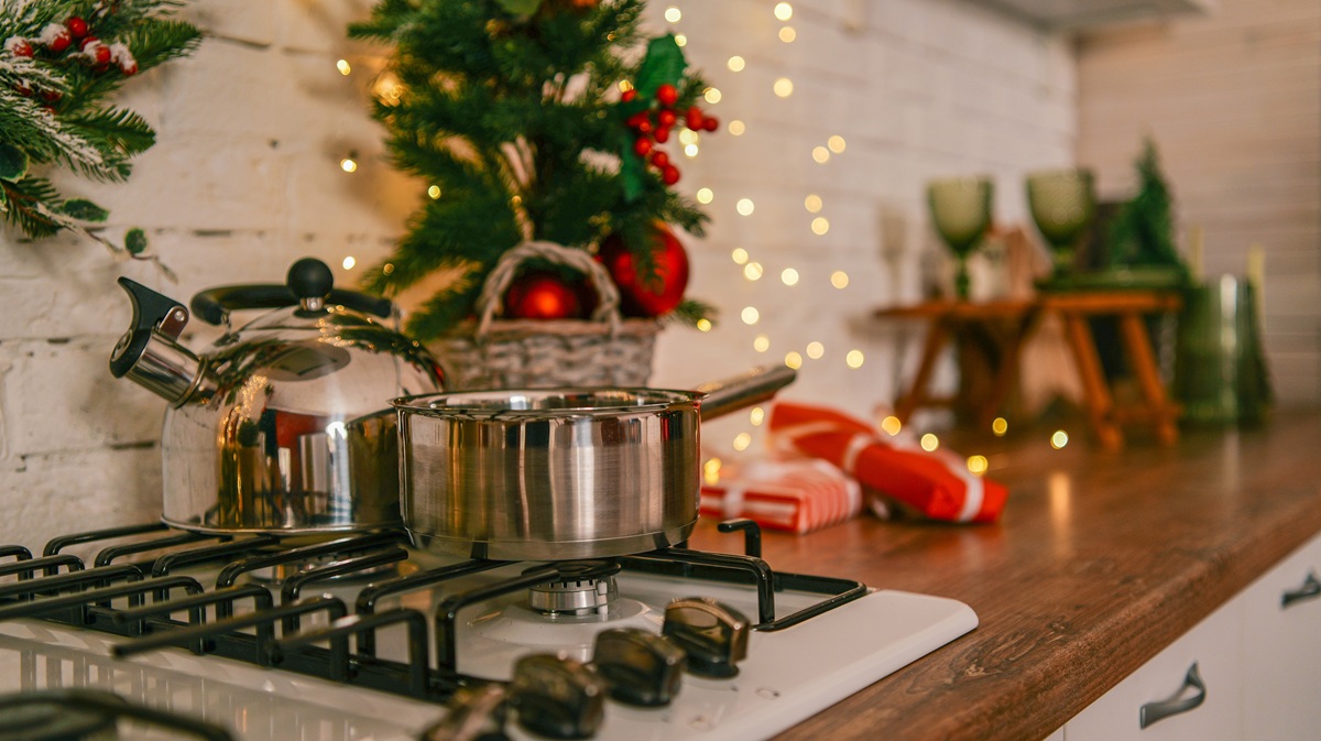 Christmas kitchen scene with festive decorations and cooking utensils